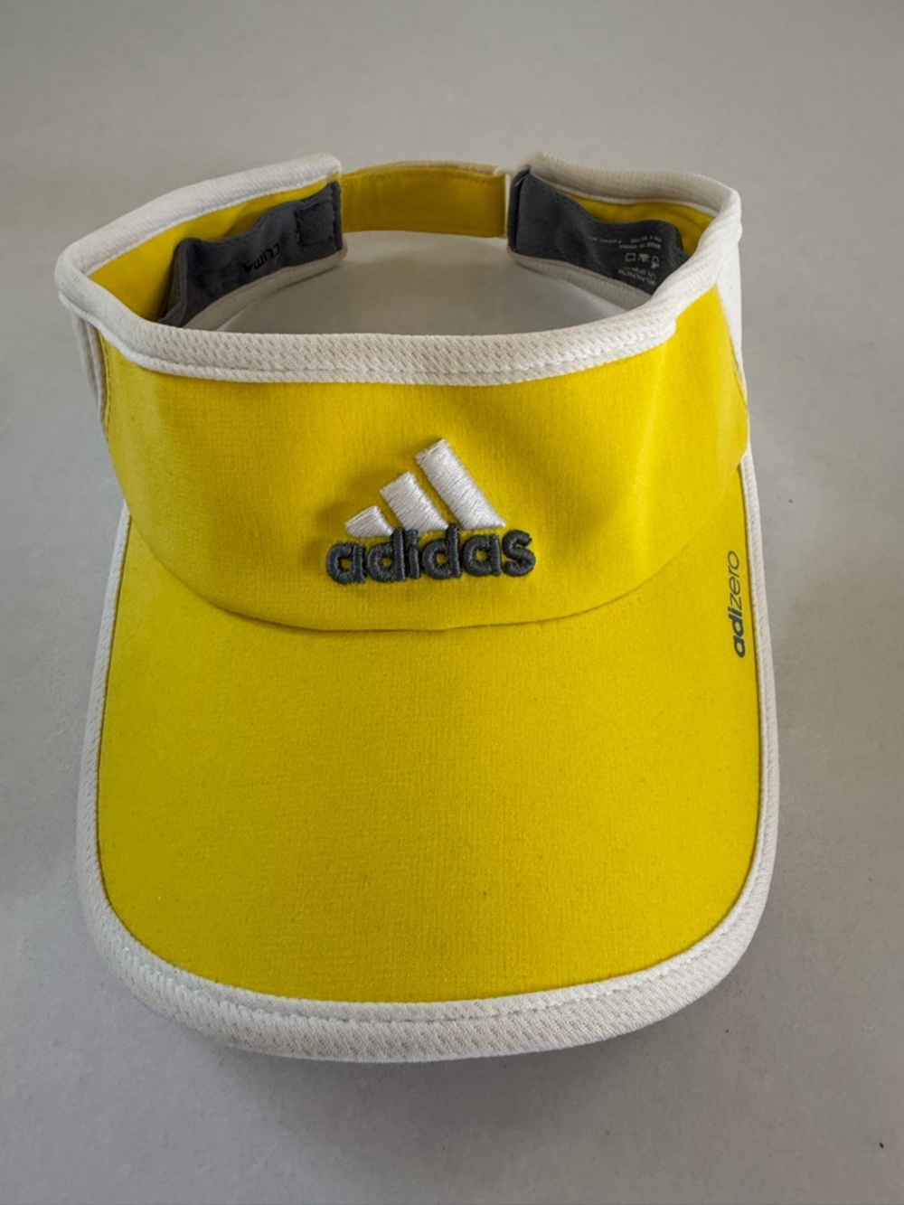 Women's Adidas adizero Lemon Yellow Visor with white trim and Velcro closure